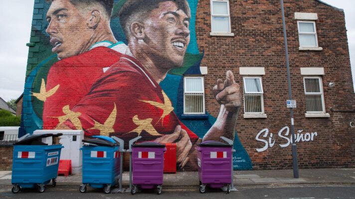 A mural of Liverpool forward Roberto Firmino on the side of a house on Merseyside