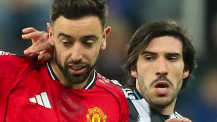 Manchester United player Bruno Fernandes with Newcastle midfielder Sandro Tonali