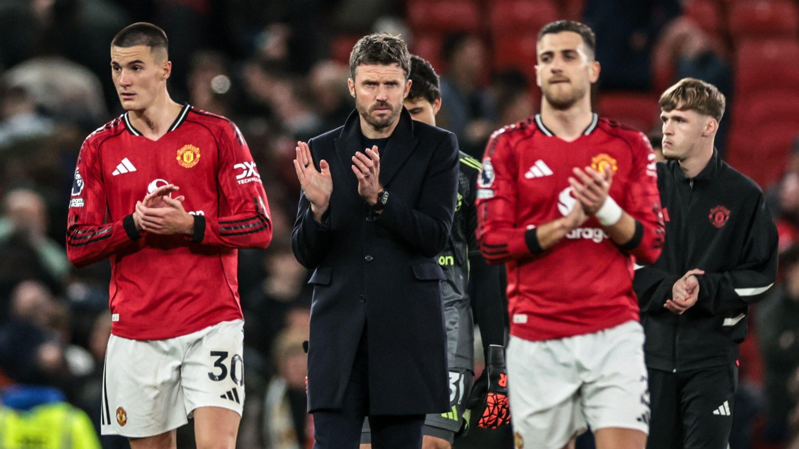 Michael Carrick applauds fans after Leeds defeat