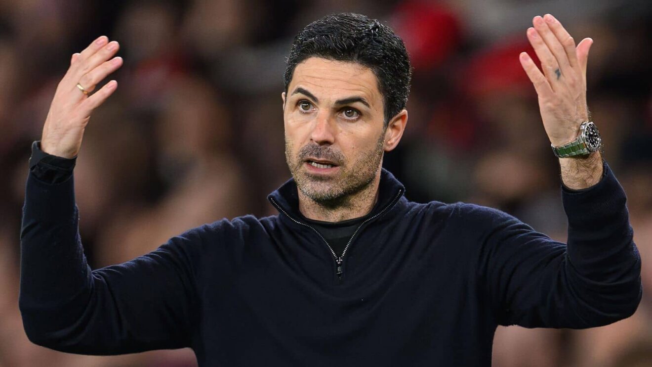 Mikel Arteta with his arms in the air, as Arsenal manager