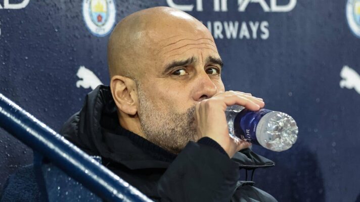 Pep Guardiola with a water bottle