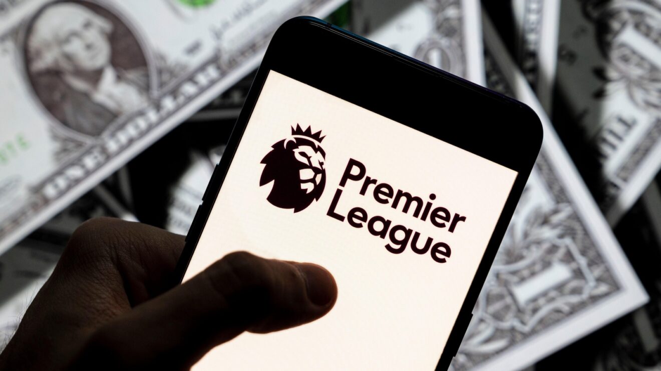 A phone with the Premier League logo, and money in the background