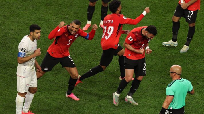 Egypt celebrate after Iran have a goal disallowed