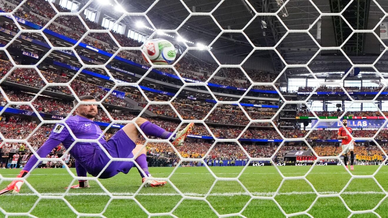 Mo Salah scores a panenka in the shoot-out win over Australia.