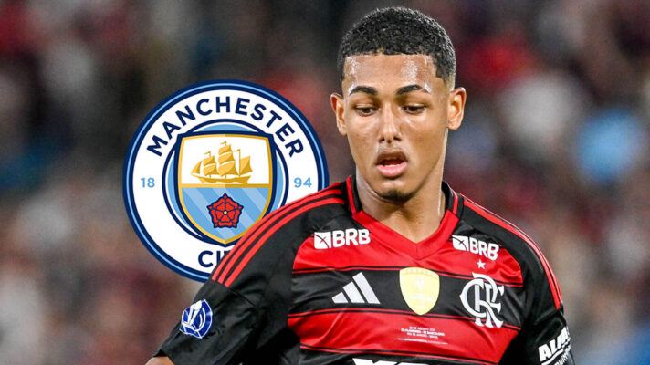 João Victor in action for Flamengo, next to a Man City badge