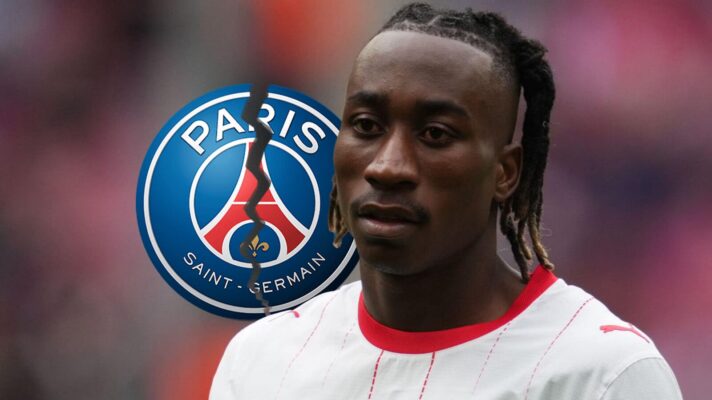Yan Diomande of RB Leipzig next to a broken PSG badge