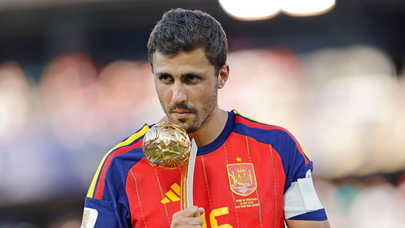 rodri with world cup golden ball trophy