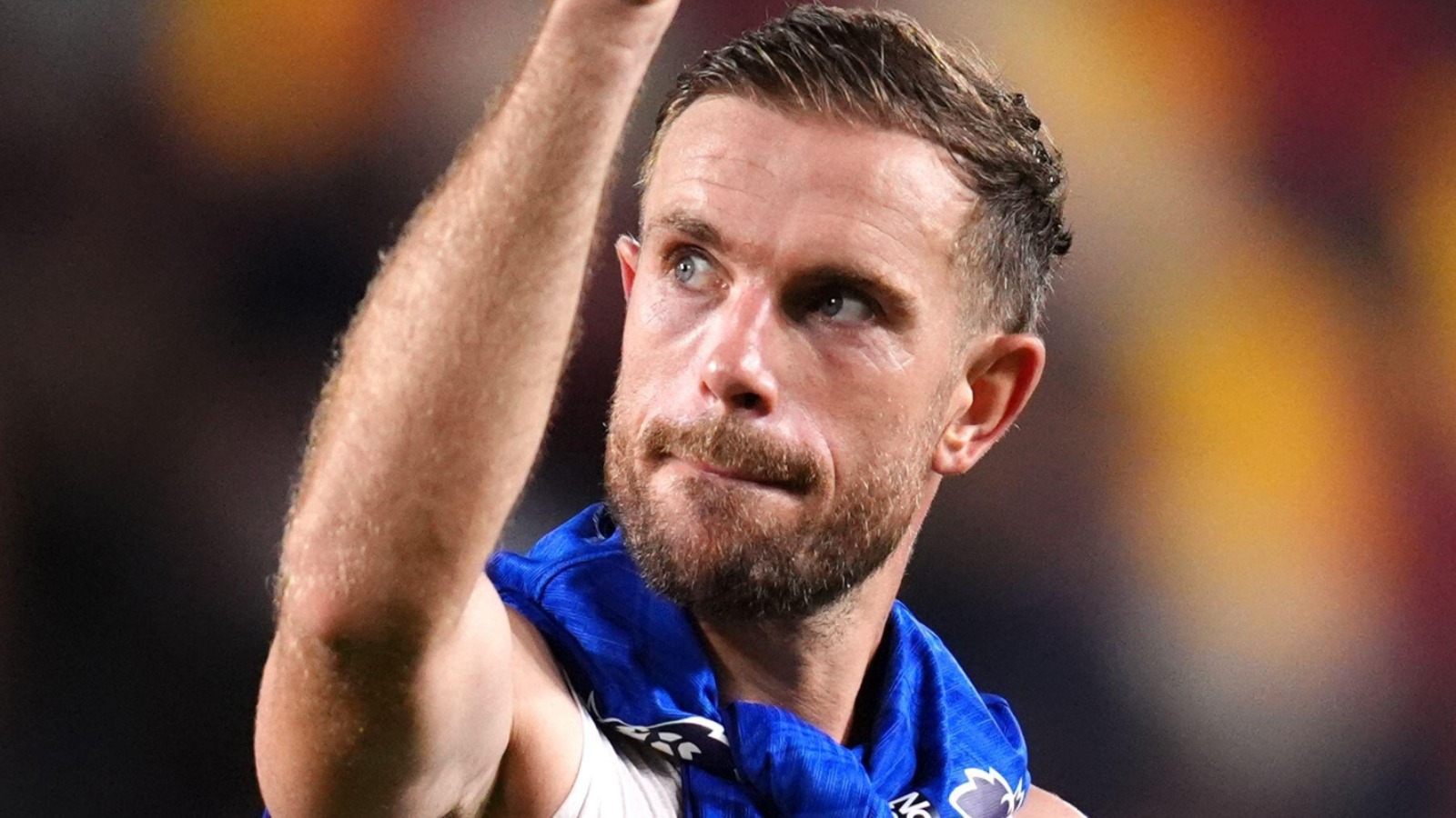 Brentford midfielder Jordan Henderson salutes the fans in a Chelsea shirt