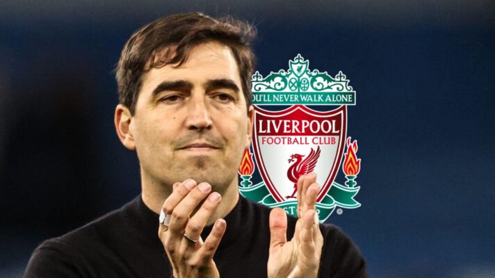 Andoni Iraola claps, next to a Liverpool badge