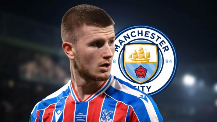 Crystal Palace's Adam Wharton with a Man City badge next to him