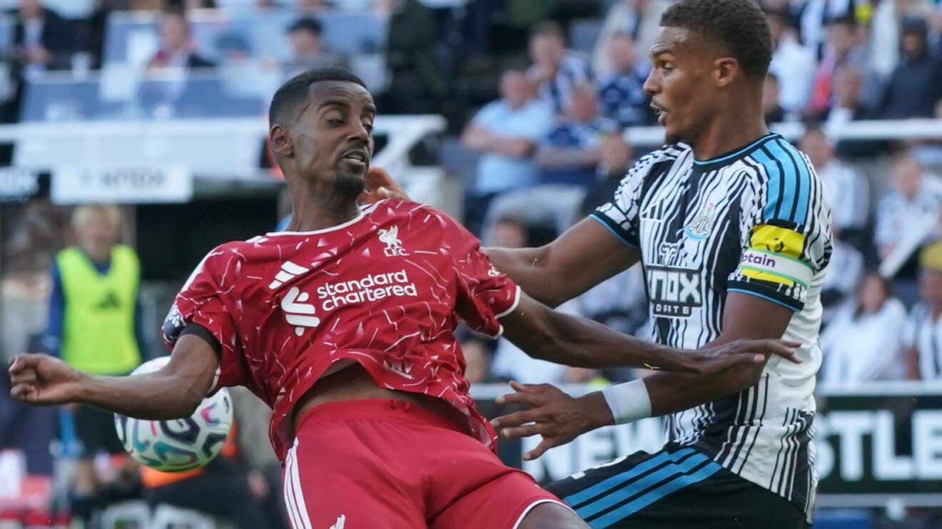 Alexander Isak and Malick Thiaw battle for the ball