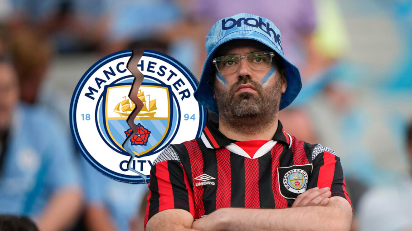 A Manchester City fan with Cracked Man City badge