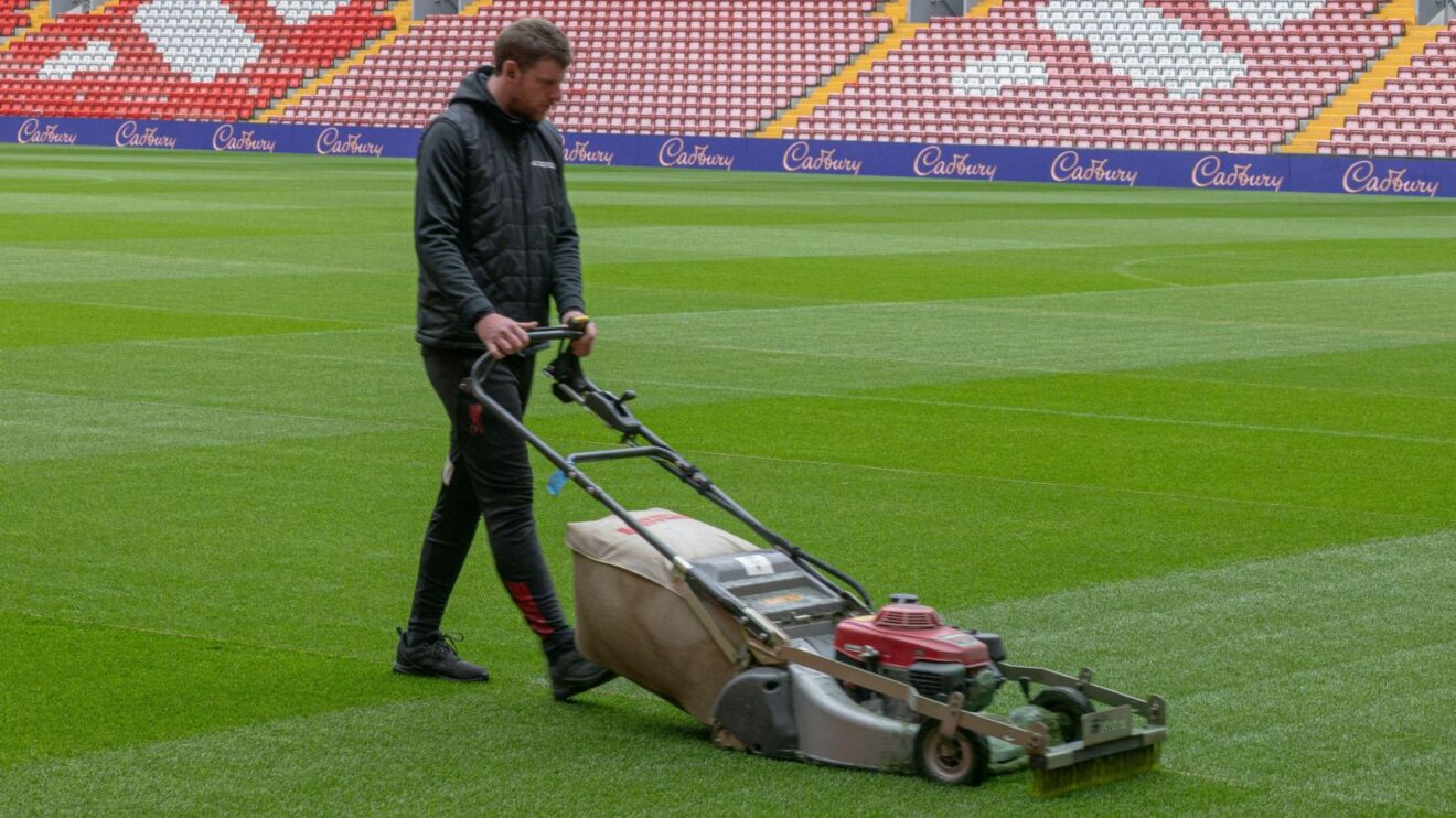 A Liverpool groundsman tends to their pitch