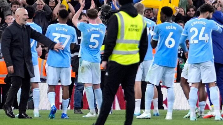 Manchester City players celebrate against Liverpool
